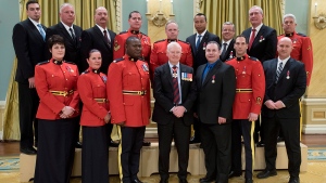 Security services members are recognized during a ceremony to pay tribute to their response efforts to the shooting events on Oct. 22, 2014 on Parliament Hill, at Rideau Hall in Ottawa on Monday, Feb. 8, 2016. (Justin Tang / THE CANADIAN PRESS)