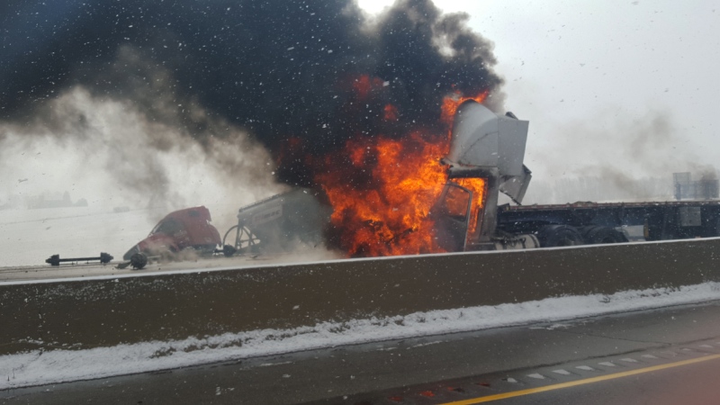 A truck caught fire following a collision on Highway 401 west of Woodstock on Wednesday, Feb. 10, 2016. (Sabrina Dell)