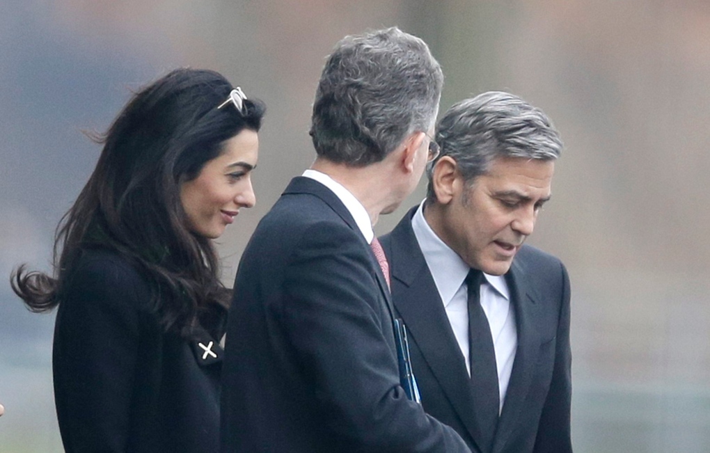 George Clooney, right, and his wife Amal Clooney