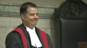 Kael McKenzie smiles after being sworn in as Canada's first transgender judge in a Manitoba courtroom on Feb. 12, 2016.