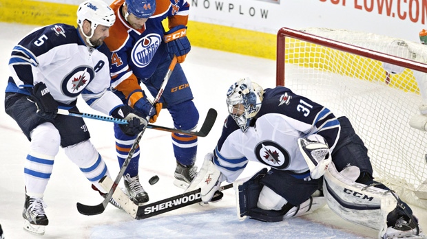Pavelec makes 21 saves in return, Ladd scores in shootout ...