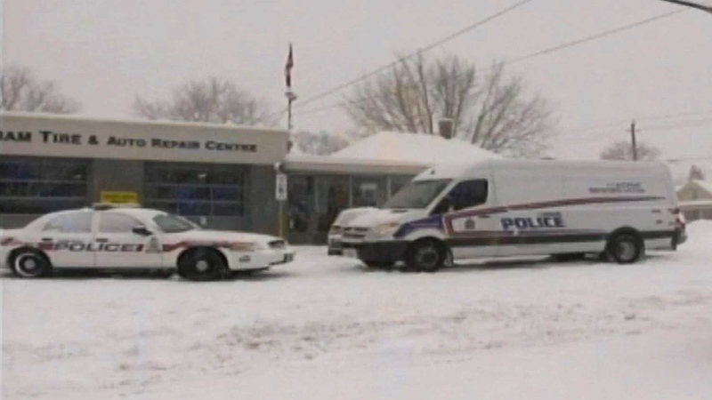A man's body was found in this automotive shop shortly after a woman's body was found in a nearby apartment in London, Ont. on Friday, Feb. 12, 2016.