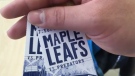 A man holds a pair of Toronto Maple Leafs tickets on Tuesday, Feb. 17, 2016. 