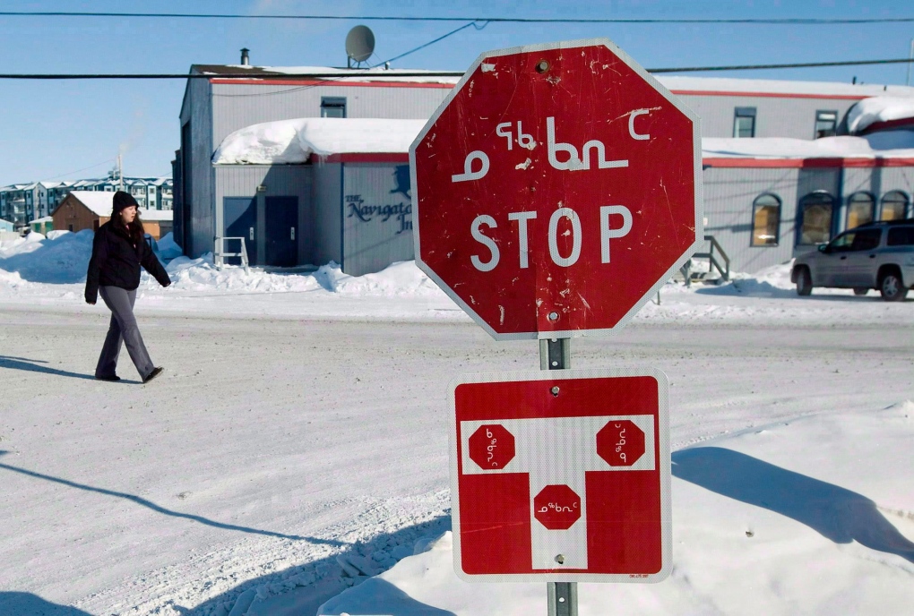 Stop sign in English and Inuktitut