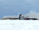 Smoke rises from a pig barn after a fire near Hensall, Ont. on Friday, Feb. 19, 2016. (Gerry Dewan / CTV London)