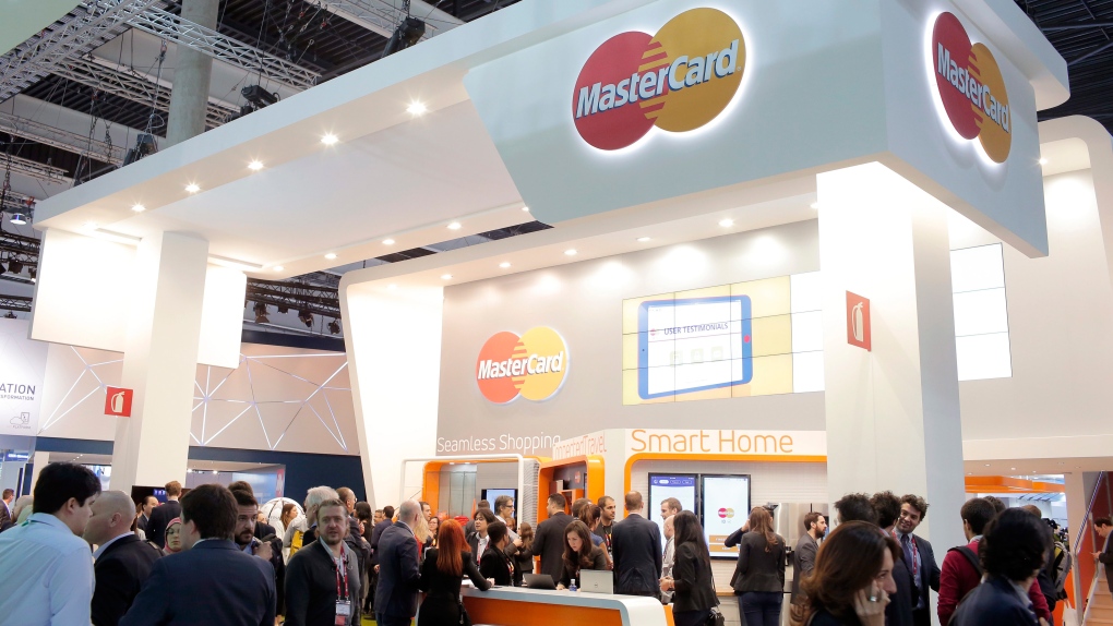 Attendees visit the MasterCard