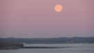 Lillian Kennedy snapped this photo of the full moon setting over Maces Bay, N.B.