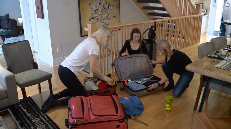 Tara, Sydney and Roxane packing for trip.