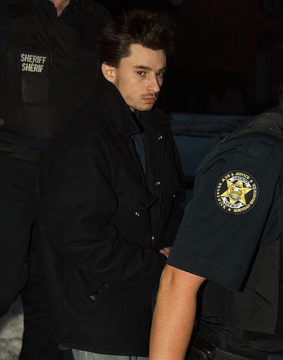 Gregory Despres, charged with two counts of first-degree murder, is escorted from court in Fredericton at the end of the first day of his trial on Monday, Jan. 8, 2007. (CP / Andrew Vaughan)