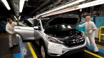 Workers inspect vehicles on the assembly line at Honda of Canada Mfg. Plant 2, in Alliston, Ont., on Monday, March 30, 2015. (THE CANADIAN PRESS/Nathan Denette)