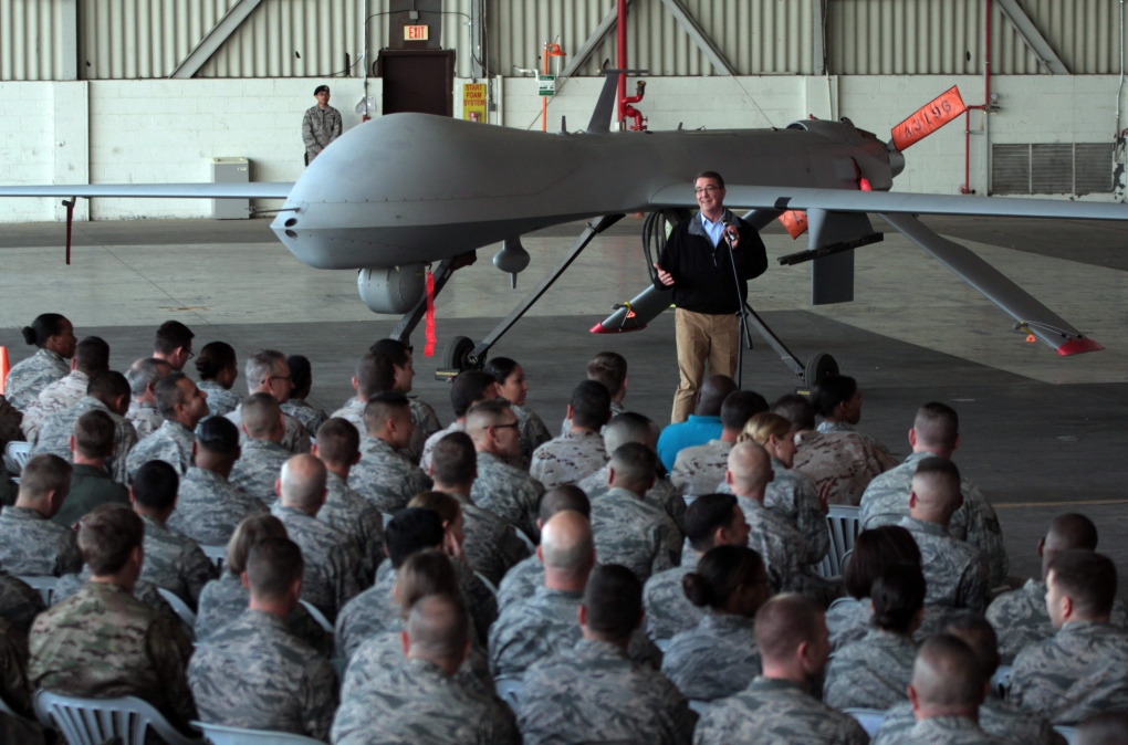Ash Carter in front of drone