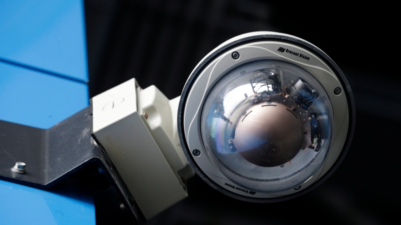 In this Oct. 15, 2014, photo, a security camera is seen at MetLife Stadium, home of the New York Giants and the New York Jets football teams, in East Rutherford, N.J. (AP Photo/Mel Evans)