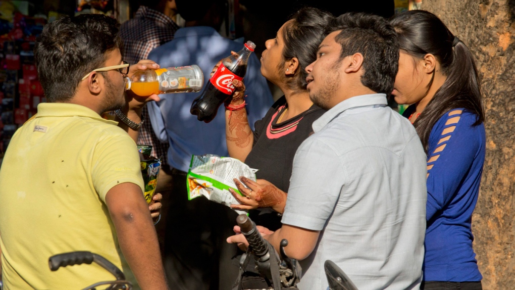 Teens at a street food stall in New Delhi, India