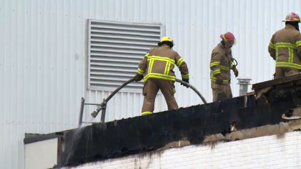 Firefighters on the roof of the Clic warehouse