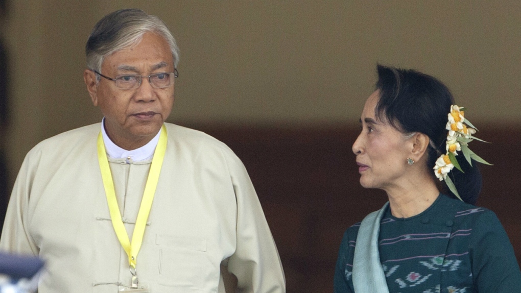 Htin Kyam walks with Aung San Suu Kyi