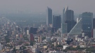 Haze hangs over Mexico City at midday, Tuesday, March 15, 2016. (AP Photo/Rebecca Blackwell)