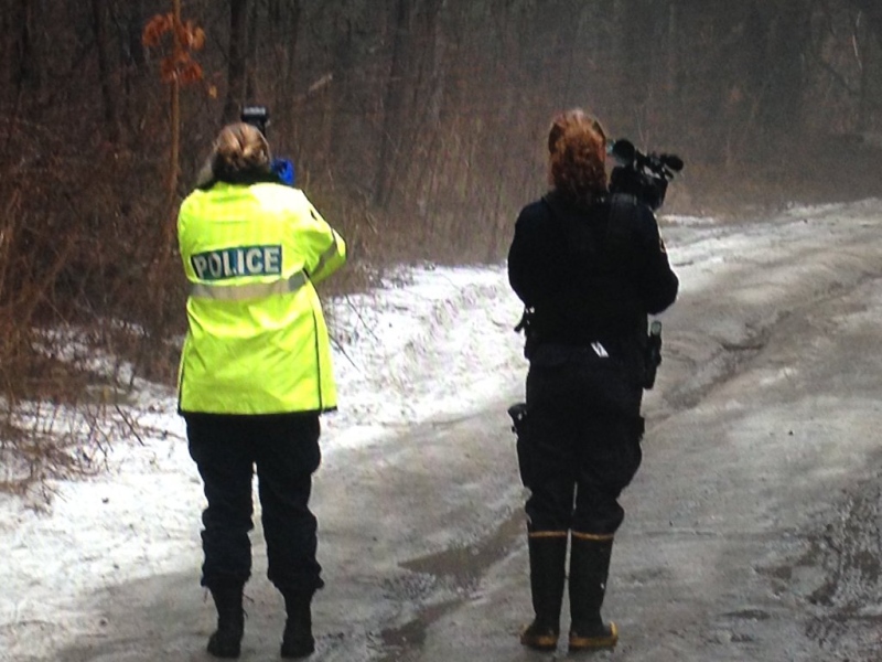 OPP officers investigate an area of the Simcoe County forest, following the discovery of human remains near Midhurst, Ont. on Wednesday, March 16, 2016. (Brandon Rowe/ CTV Barrie)