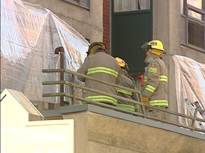 Firefighters inspect areas of the Radisson Hotel in Ottawa, after a suspicious fire broke out on Thursday, Jan. 1, 2009.