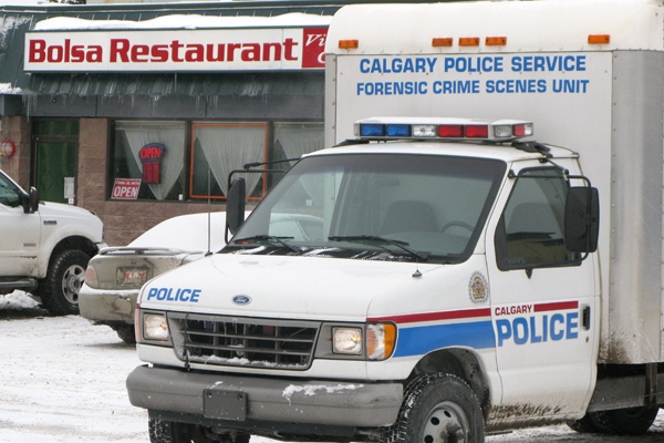 A Calgary restaurant where three men were killed Thursday remained closed Friday, Jan.2, 2009 as police continue to investigate. (Bill Graveland / THE CANADIAN PRESS)