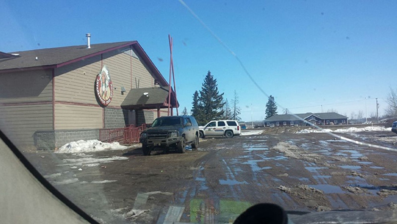 An RCMP vehicle sits parked in front of the Ahtahkakoop Cree Nation's band office on Tuesday, March 29, 2016. Mounties say one man is dead after a shooting in the community. (Viewer submitted)