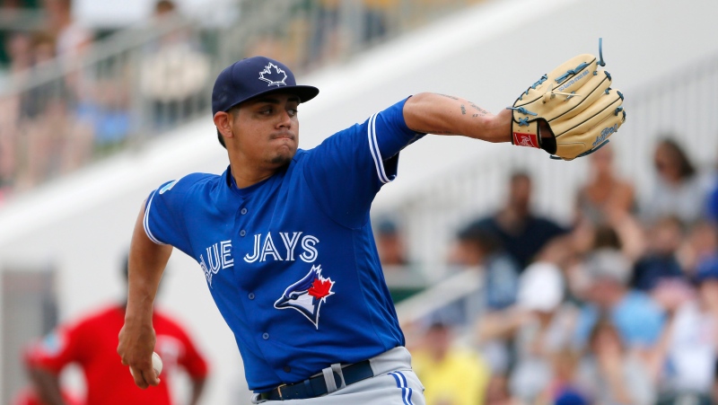 Toronto Blue Jays relief pitcher Roberto Osuna works against the Minnesota Twins in the fifth inning of a spring training baseball game on March 30, 2016, in Fort Myers, Fla. (Tony Gutierrez / AP Photo)