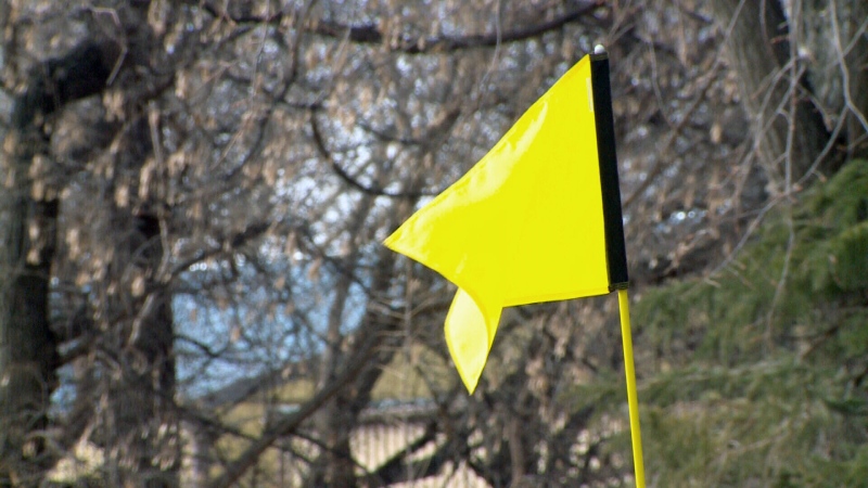 A flag blows in the wind at the Wildwood Golf Course on Friday, April 1, 2016. 