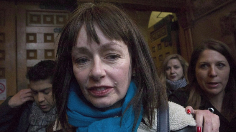 Lucy DeCoutere leaves a Toronto courthouse, on Thursday, March 24, 2016. (THE CANADIAN PRESS/Chris Young)