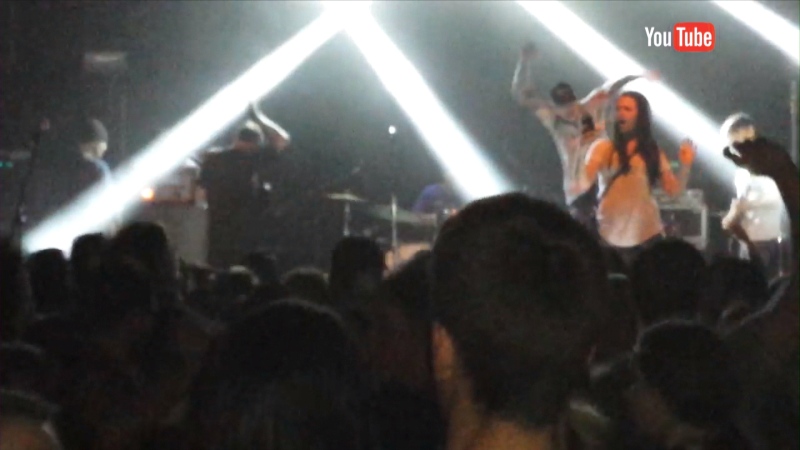 A screen grab image from the YouTube video that shows a fan at a The Story So Far concert in Toronto being kicked in the back by the band's lead singer. 