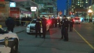 Police officers can be seen on Yonge Street after one man was shot on Wednesday, April 13, 2016. 