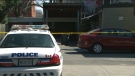 Police tape is seen behind a building in the Broadview Avenue and Gerrard Street East area following the discovery on what police said could be human remains on Tuesday, April 19, 2016.