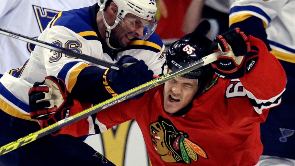 Chicago Blackhawks right wing Andrew Shaw, right