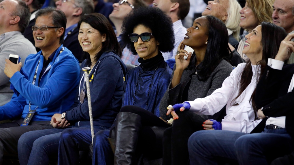 Prince, dead at 57, shown at NBA game