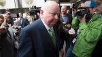 Sen. Mike Duffy makes his way towards his car as he leaves the courthouse, Thursday, April 21, 2016 in Ottawa. Duffy has been cleared of all 31 fraud, breach of trust and bribery charges he had been facing in relation to the long-running Senate expense scandal. THE CANADIAN PRESS/Adrian Wyld