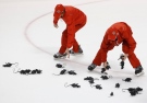 Crews round up rats thrown on the ice by fans after Florida Panthers defenseman Dmitry Kulikov scored an empty-net goal during the third period of Game 2 in a first-round NHL hockey Stanley Cup playoff series against the New York Islanders in Sunrise, Fla., on Friday, April 15, 2016. (AP / Wilfredo Lee)