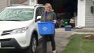 Margaret Fraser takes her recycling to the curb in Ottawa's Manor Park, April 26, 2016