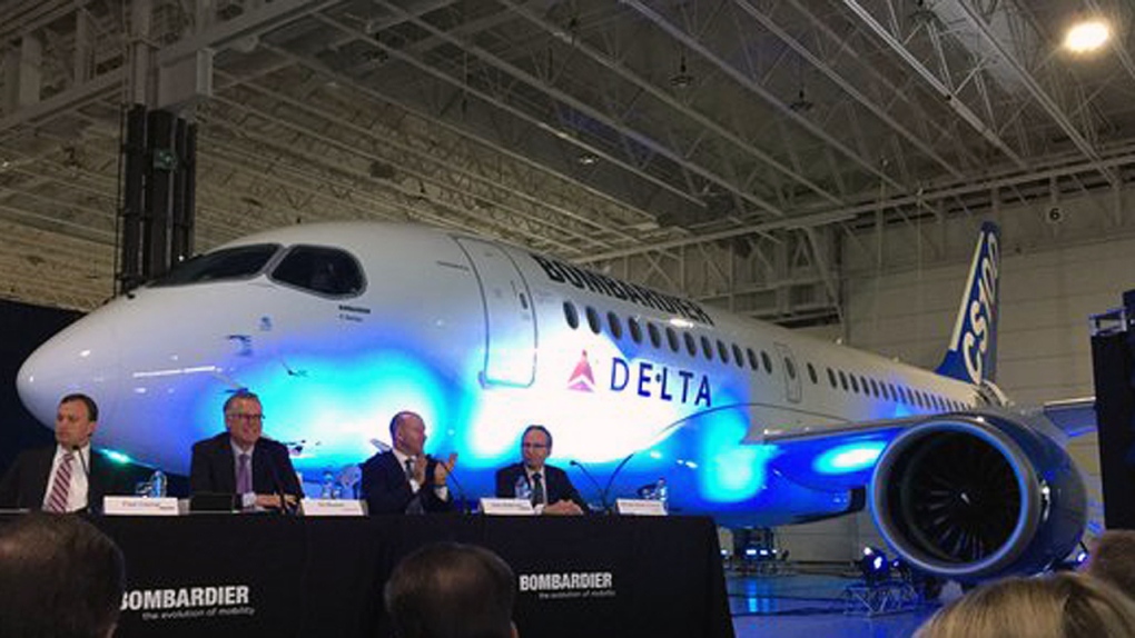 Bombardier executives present the Delta Air Lines