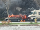 A vehicle and RV catch fire in Windsor, Ont., on Friday, April 29, 2016. (Courtesy Jay Lockley) 