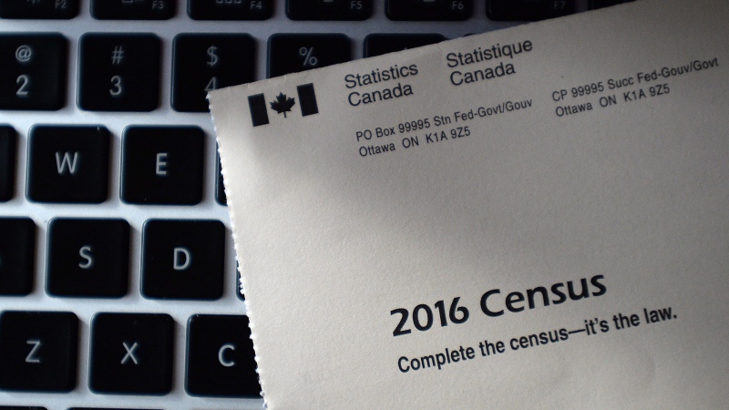 A Statistics Canada 2016 Census sits on the key board of a laptop after arriving in the mail at a home in Ottawa on Monday, May 2, 2016. (THE CANADIAN PRESS/Sean Kilpatrick)