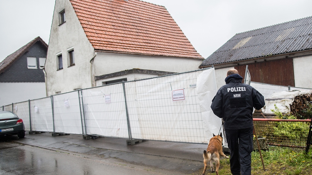 Police at scene of German murder suspect couple