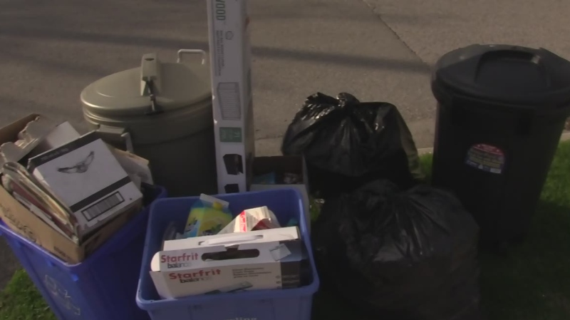 Garbage and recycling sits on the curb of a street in London, Ont, on Wednesday, May 4, 2016. (Bryan Bicknell / CTV London)