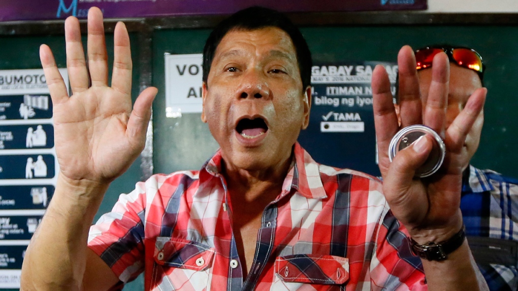 Rodrigo Duterte gestures in Davao city
