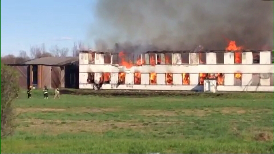 Fire burns through abandoned barracks
