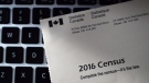 A Statistics Canada 2016 Census sits on the key board of a computer after arriving in the mail at a home in Ottawa in a May 2, 2016, file photo. (Sean Kilpatrick / THE CANADIAN PRESS)