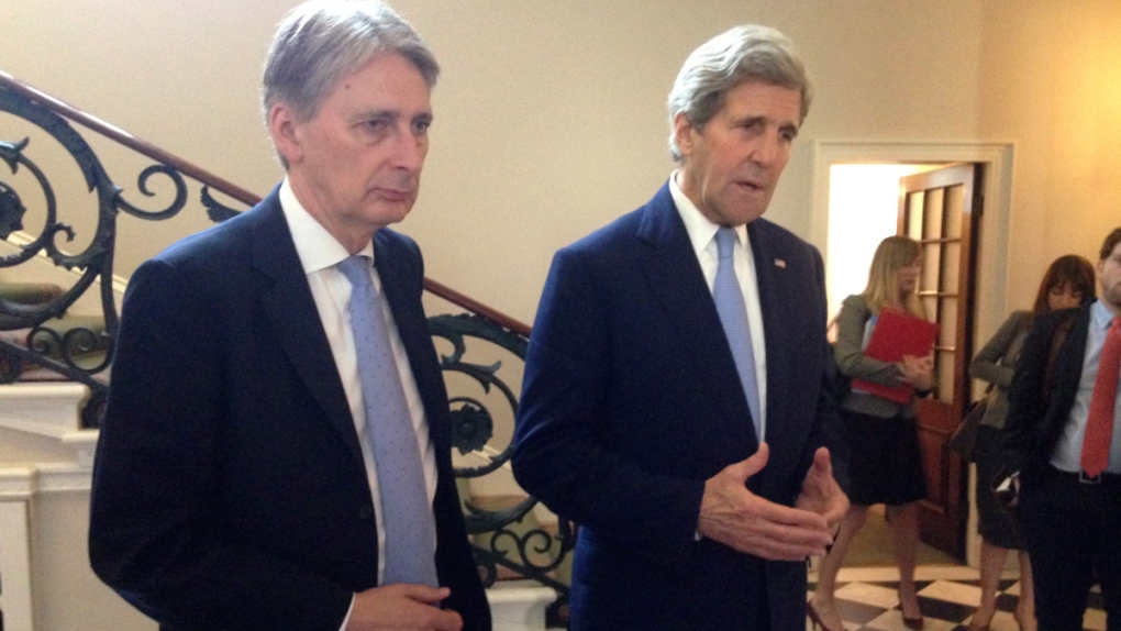 John Kerry, right, and Philip Hammond