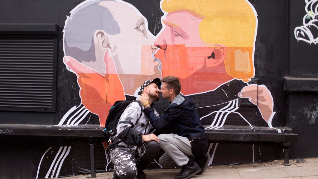 Trump kissing Putin poster