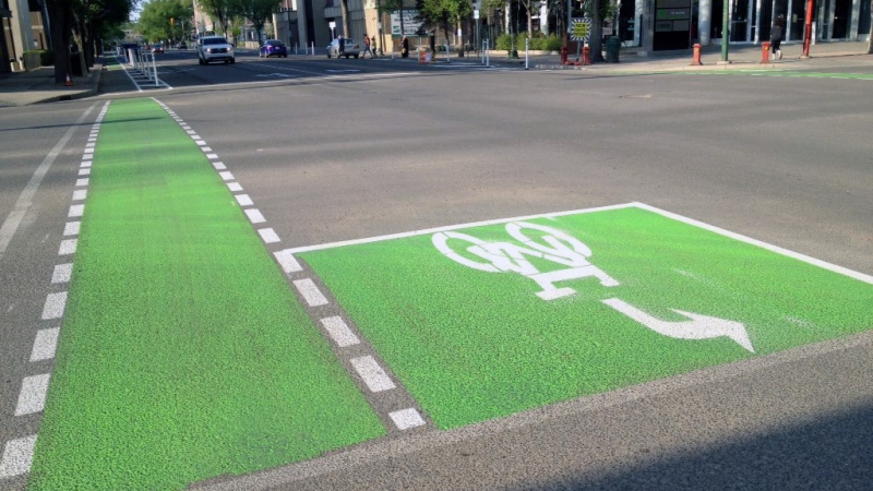 Fresh paint marks two new protected bike lanes on Saskatoon's Fourth Avenue. The lanes opened Monday, May 16, 2016, as part of a city pilot project. (Colin Thomas/CTV Saskatoon)