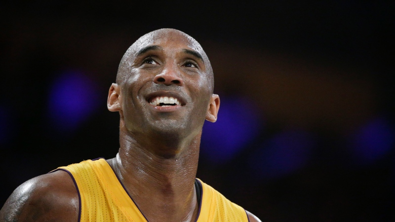 FILE - In this April 13, 2016 file photo, Kobe Bryant smiles during the first half of Bryant's last NBA basketball game, against the Utah Jazz in Los Angeles. (AP Photo/Jae C. Hong, File)