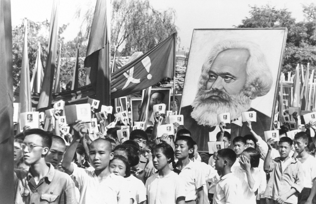 Chinese youth with poster of Karl Marx 
