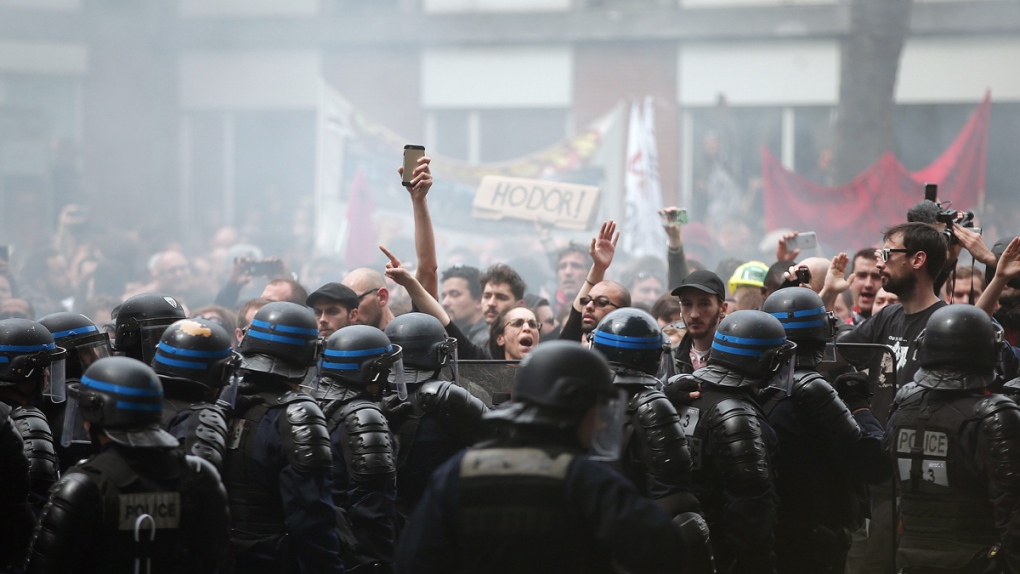 Police and protesters at a demonstration in Paris