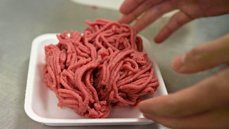 Fresh ground beef is packed at a local butcher shop on Oct. 1, 2012 in Levis Que. (The Canadian Press/Jacques Boissinot)